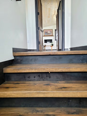Custom built and stained stair treads made from reclaimed oak.