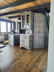 Grey stained kitchen cabinets made from reclaimed worm-y maple.