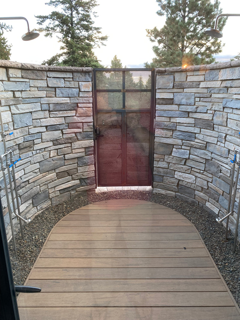 outdoor shower and reclaimed wood and custom steel gate