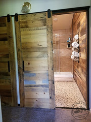 pair of bathroom reclaimed wood doors on RLP low profile mini v track barn door hardware