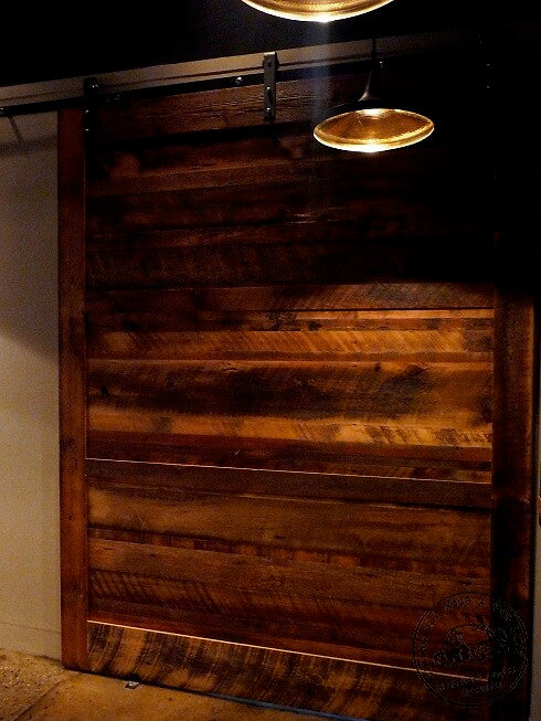 horizontal panels in oversized sliding reclaimed wood door
