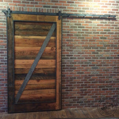 This is our standard reclaimed wood door slab with a metal crossbar and frame added for interest.
