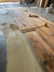 Glue down mastic to slab reclaimed engineered wood flooring