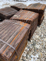 bundles of salvaged corrugated metal roofing
