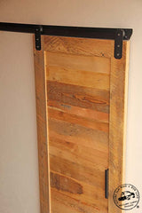 Channel track barn door hardware with reclaimed wood door